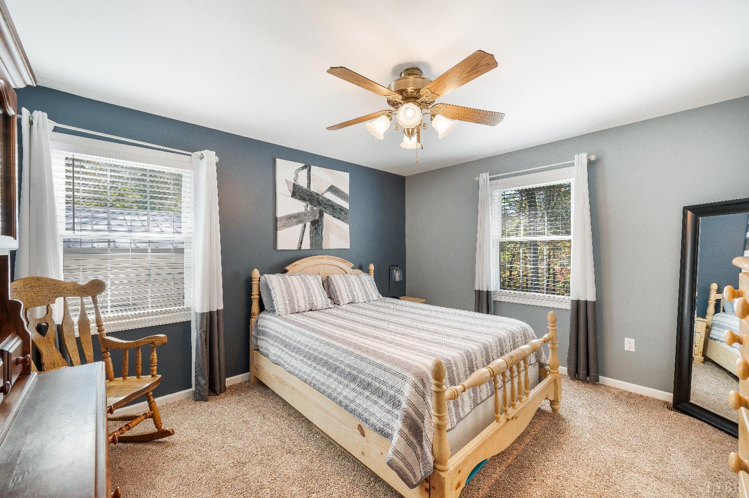 405 Marston Street Spout Spring, VA 24593 - Photo 22 of 58 a bedroom with a bed and a chandelier