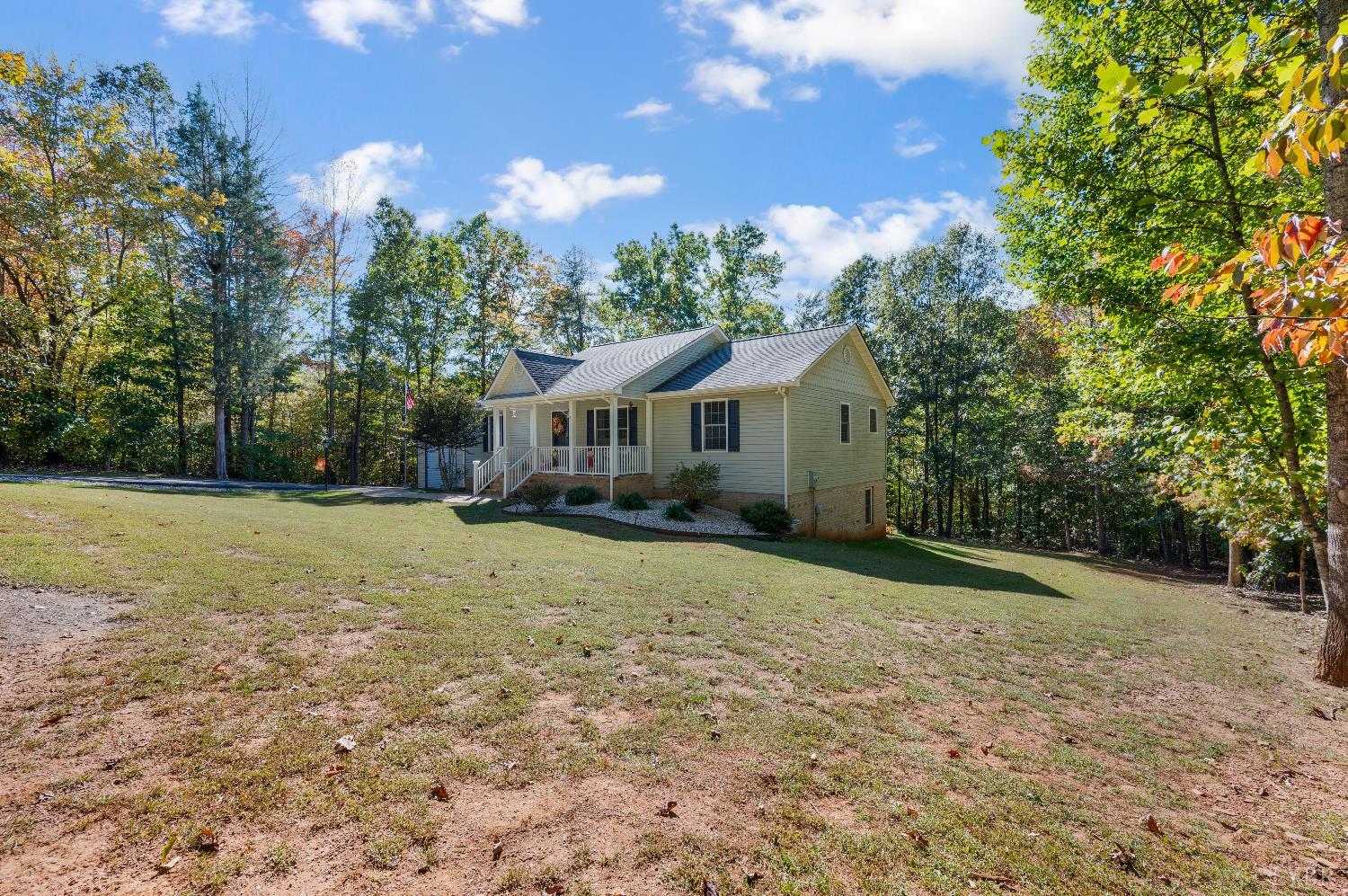 405 Marston Street Spout Spring, VA 24593 - Photo 29 of 58 a front view of house with yard and trees
