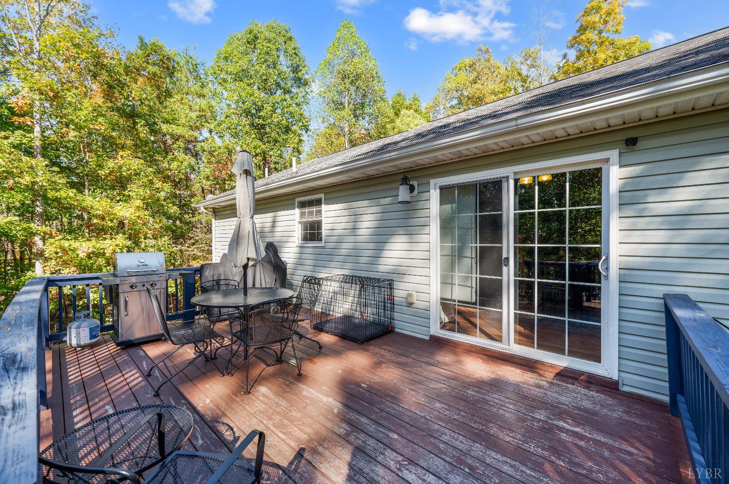 405 Marston Street Spout Spring, VA 24593 - Photo 37 of 58 a view of house with backyard outdoor seating and wooden floor