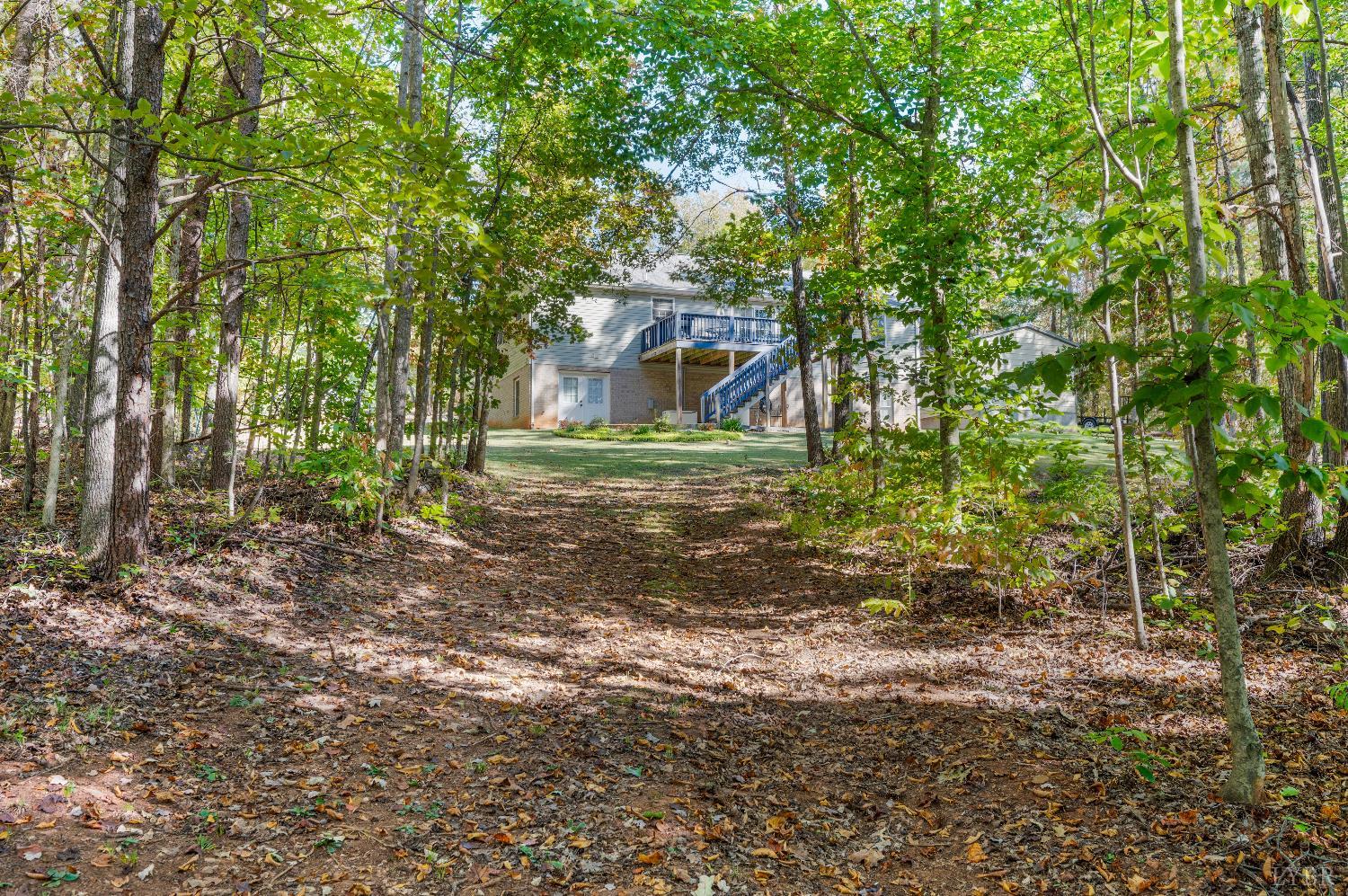 405 Marston Street Spout Spring, VA 24593 - Photo 42 of 58 a small yard with large trees