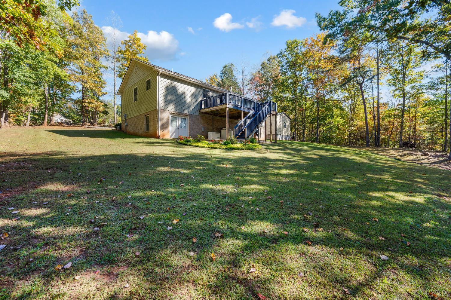405 Marston Street Spout Spring, VA 24593 - Photo 44 of 58 a front view of a house with a yard and trees
