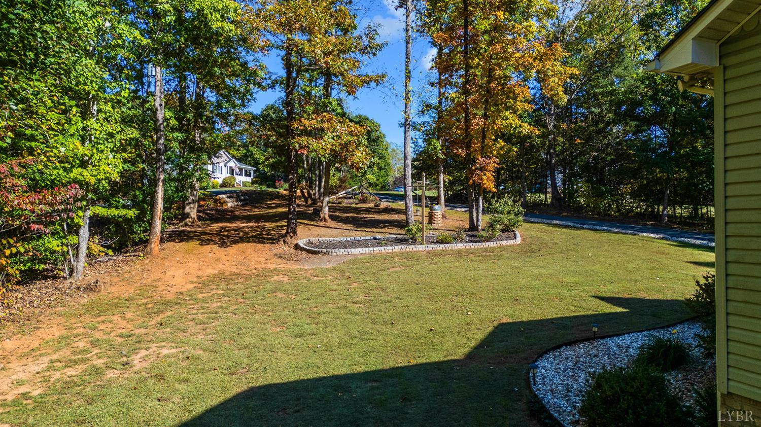 405 Marston Street Spout Spring, VA 24593 - Photo 55 of 58 a view of a swimming pool with lawn chairs under an umbrella