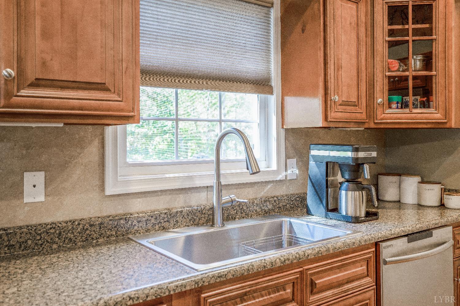 405 Marston Street Spout Spring, VA 24593 - Photo 8 of 58 a kitchen with granite countertop a sink and a window