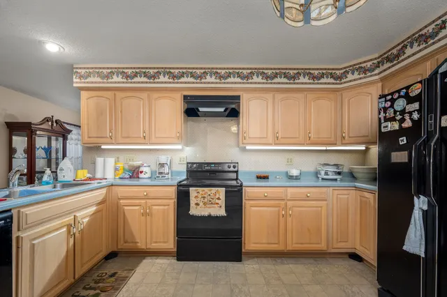 a view of living room with furniture and flat screen tv