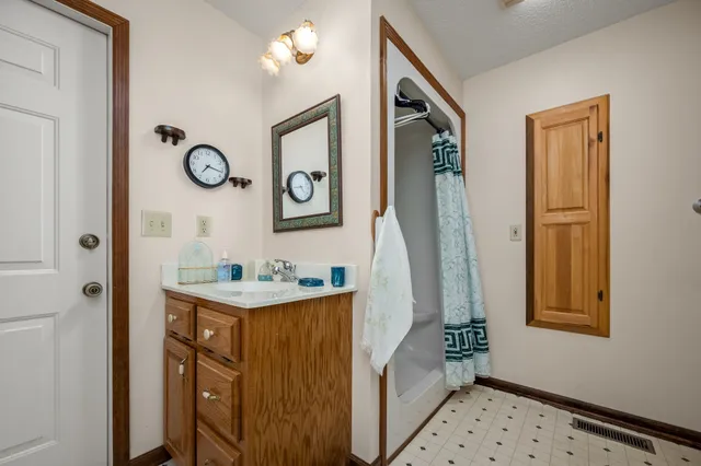 a dining room with furniture and a chandelier