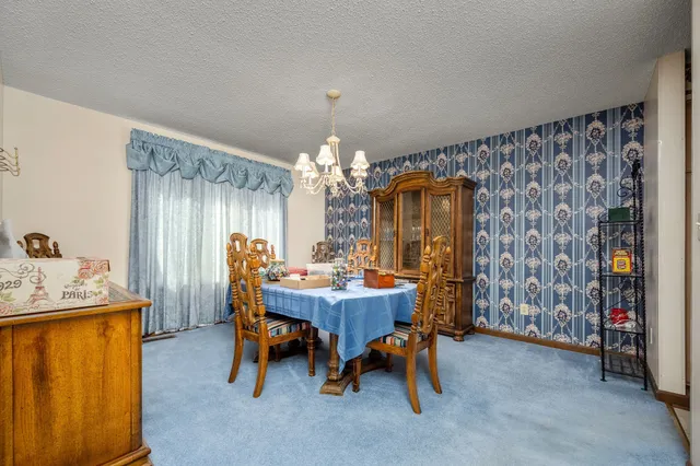 a kitchen with a sink and a refrigerator