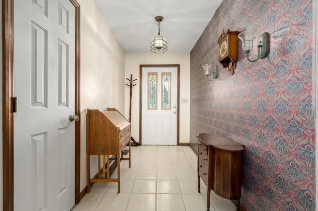 a view of yard with swimming pool and trees