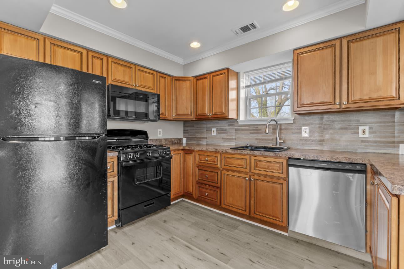 2528 Wendover Road, Unit B Baltimore, MD 21234 - Photo 10 of 22 Modern kitchen with warm wood tones.