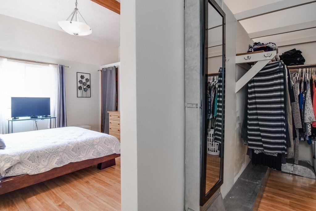 2 Lamplight Circle Natick, MA 01760 - Photo 15 of 23 a bedroom with bed and a chandelier