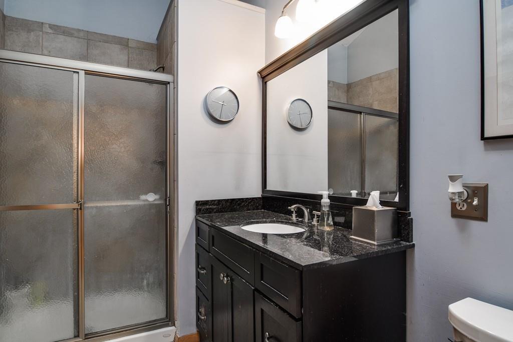 2 Lamplight Circle Natick, MA 01760 - Photo 16 of 23 a bathroom with a sink and a mirror