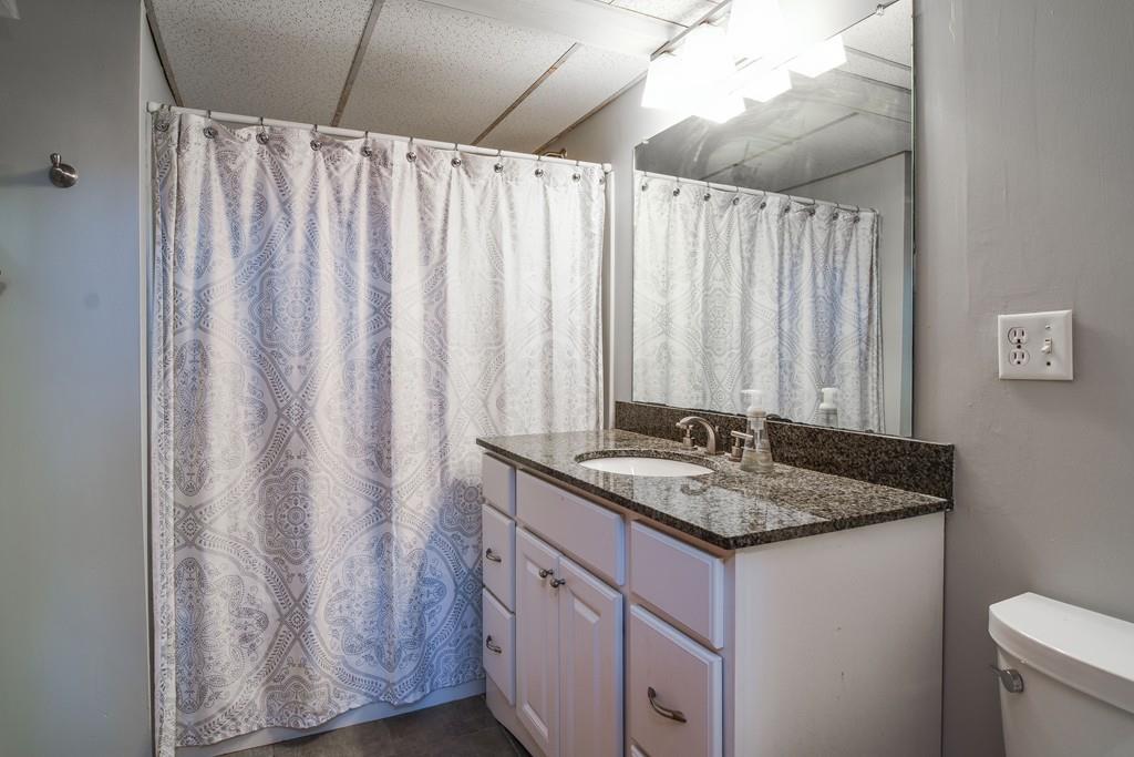 2 Lamplight Circle Natick, MA 01760 - Photo 18 of 23 a bathroom with a granite countertop sink and a mirror