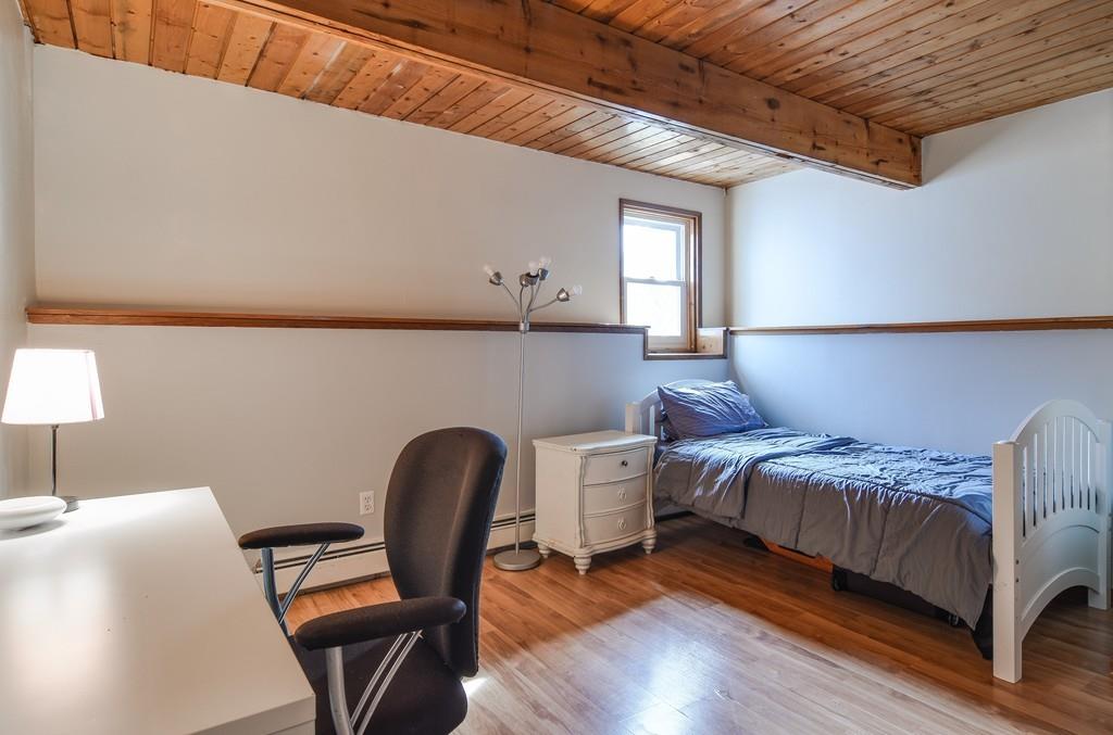 2 Lamplight Circle Natick, MA 01760 - Photo 19 of 23 a bedroom with a bed chair and a lamp on dresser