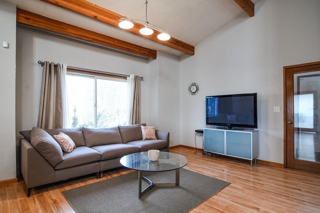 2 Lamplight Circle Natick, MA 01760 - Photo 2 of 23 a living room with furniture and a flat screen tv