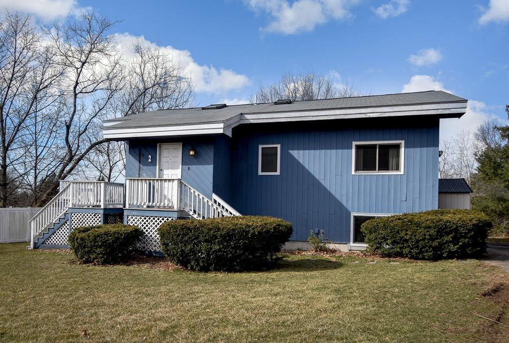 2 Lamplight Circle Natick, MA 01760 - Photo 23 of 23 a front view of a house with garden