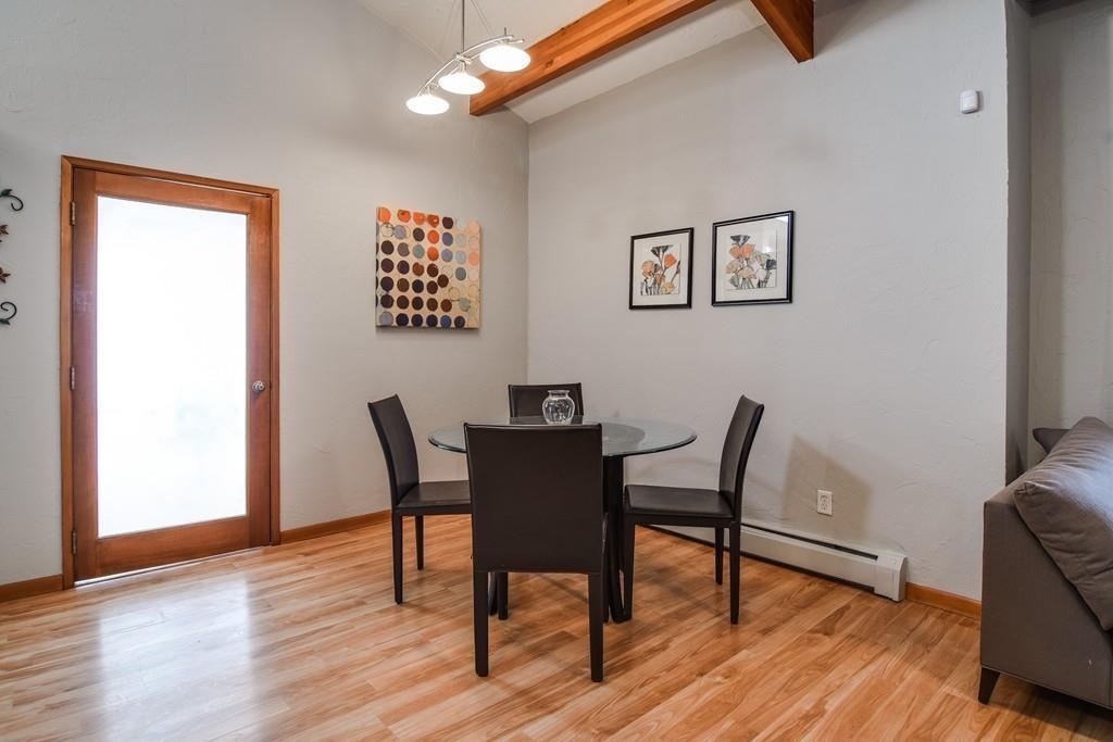 2 Lamplight Circle Natick, MA 01760 - Photo 6 of 23 a view of a dining room with furniture and wooden floor