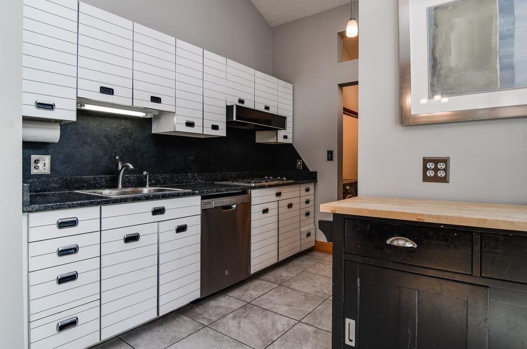 2 Lamplight Circle Natick, MA 01760 - Photo 10 of 23 a kitchen with stainless steel appliances granite countertop a sink a stove and a microwave