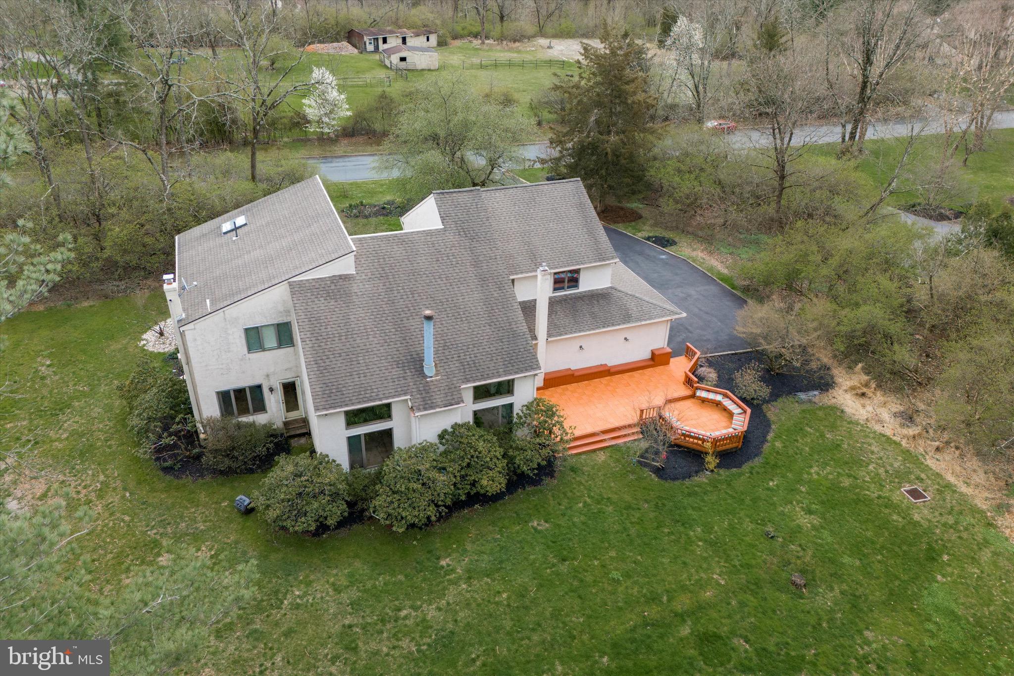 1000 Stonebridge Road Lower Gwynedd, PA 19002 - Photo 12 of 67 an aerial view of a house with garden space and street view