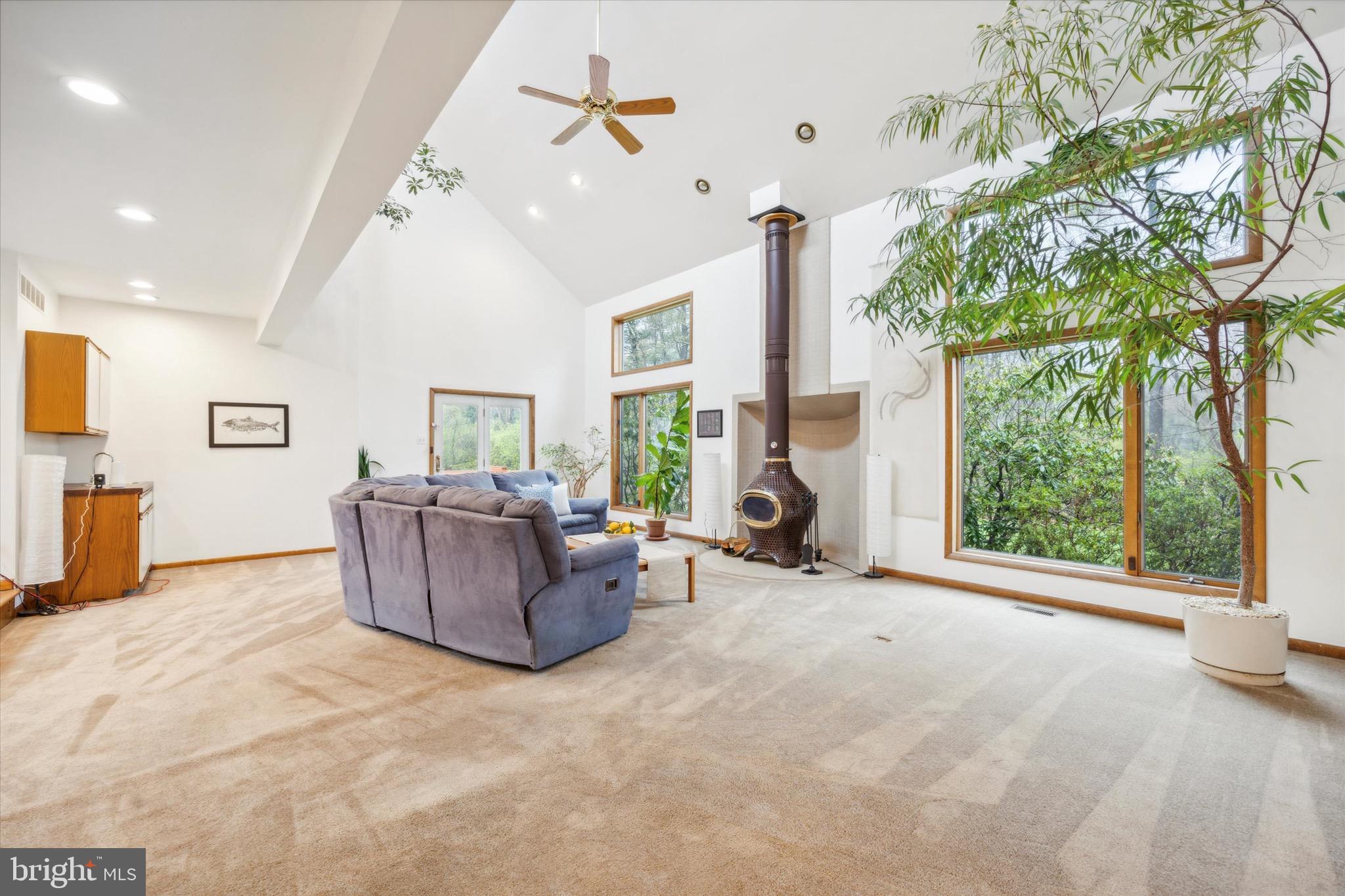 1000 Stonebridge Road Lower Gwynedd, PA 19002 - Photo 23 of 67 a living room with furniture and a large window