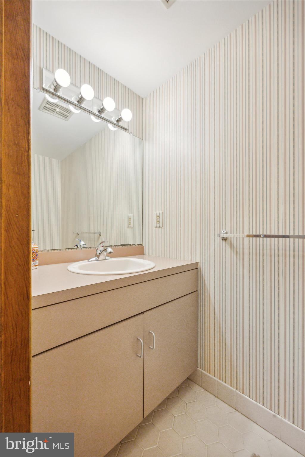 1000 Stonebridge Road Lower Gwynedd, PA 19002 - Photo 32 of 67 a bathroom with a double vanity sink and a mirror