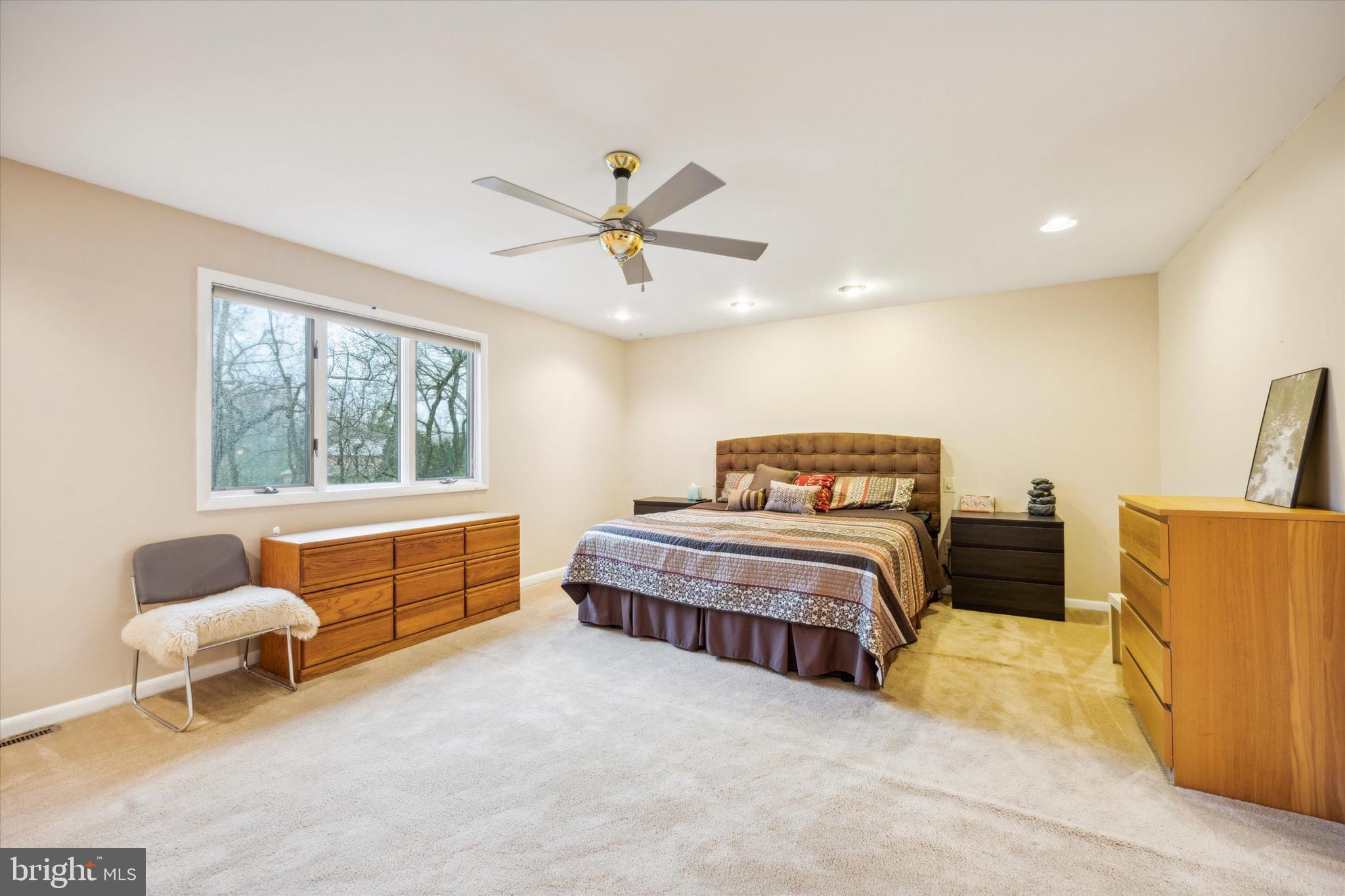 1000 Stonebridge Road Lower Gwynedd, PA 19002 - Photo 36 of 67 a spacious bedroom with a bed and a couch