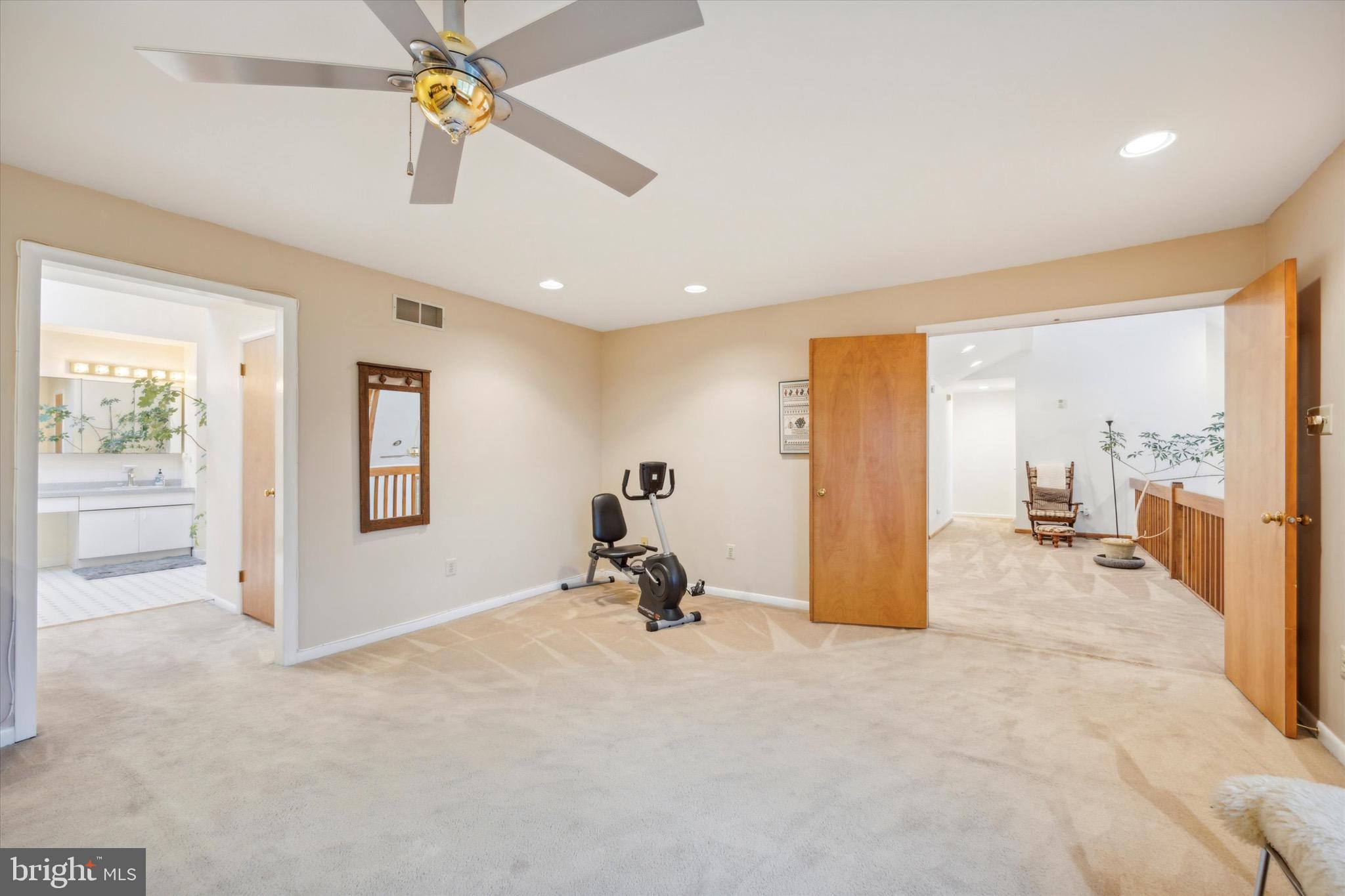 1000 Stonebridge Road Lower Gwynedd, PA 19002 - Photo 38 of 67 a view of a room with gym equipment and a chandelier