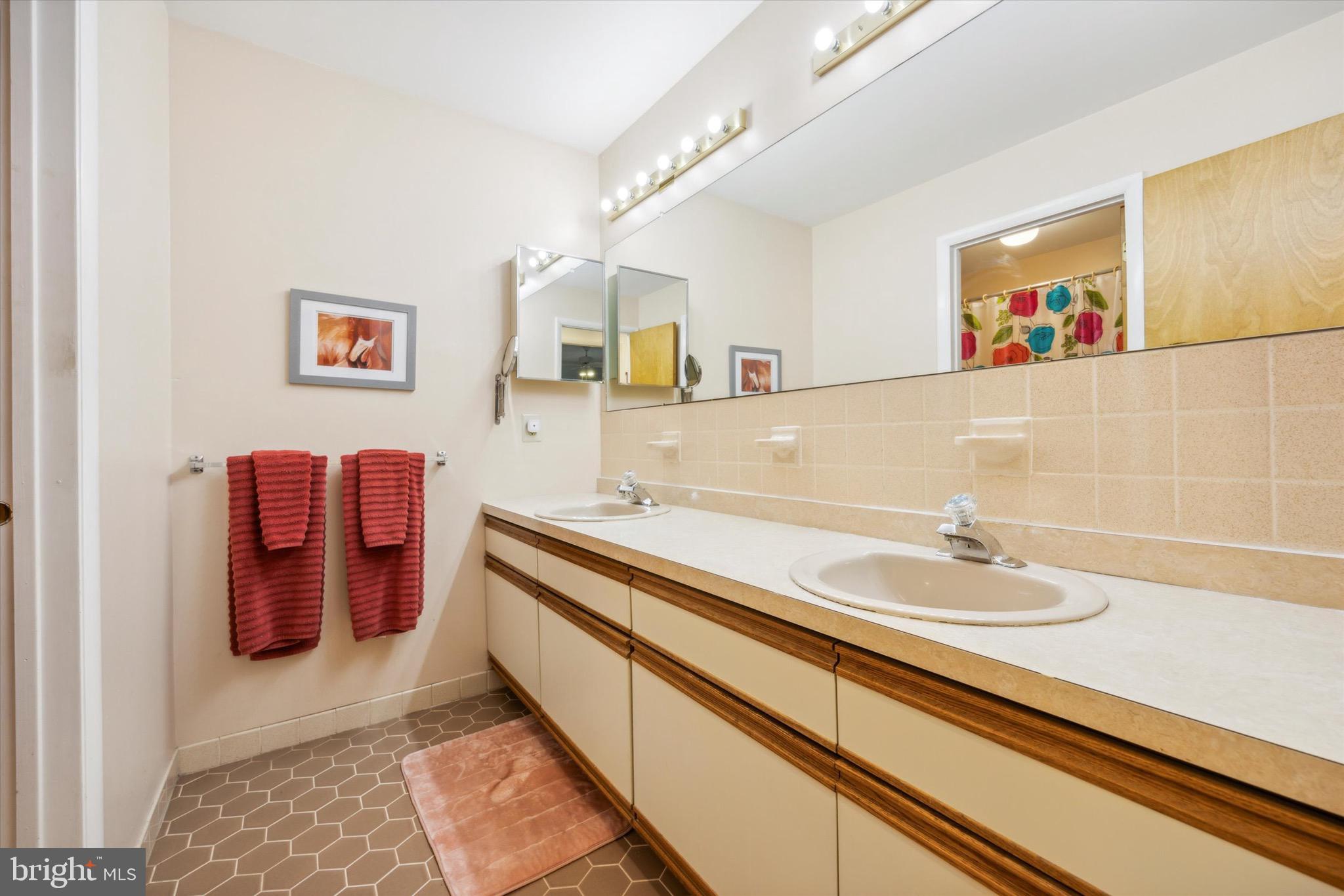 1000 Stonebridge Road Lower Gwynedd, PA 19002 - Photo 47 of 67 a bathroom with a sink and a mirror