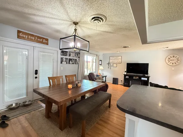 a kitchen with granite countertop cabinets and white appliances