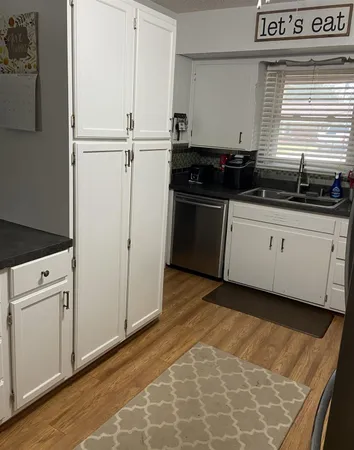 a kitchen with a stove and a cabinet