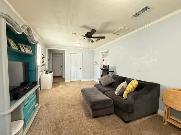 a living room with furniture and a window