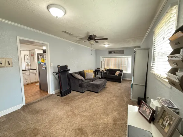 a view of a livingroom with furniture and a fireplace