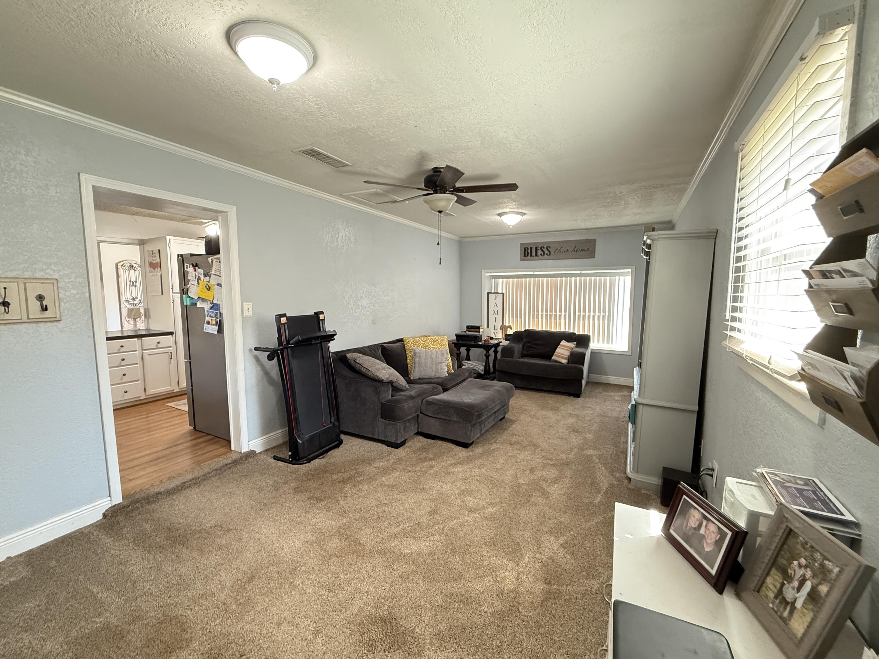 1006 West 11th Street Post, TX 79356 - Photo 18 of 39 a living room with furniture and a window