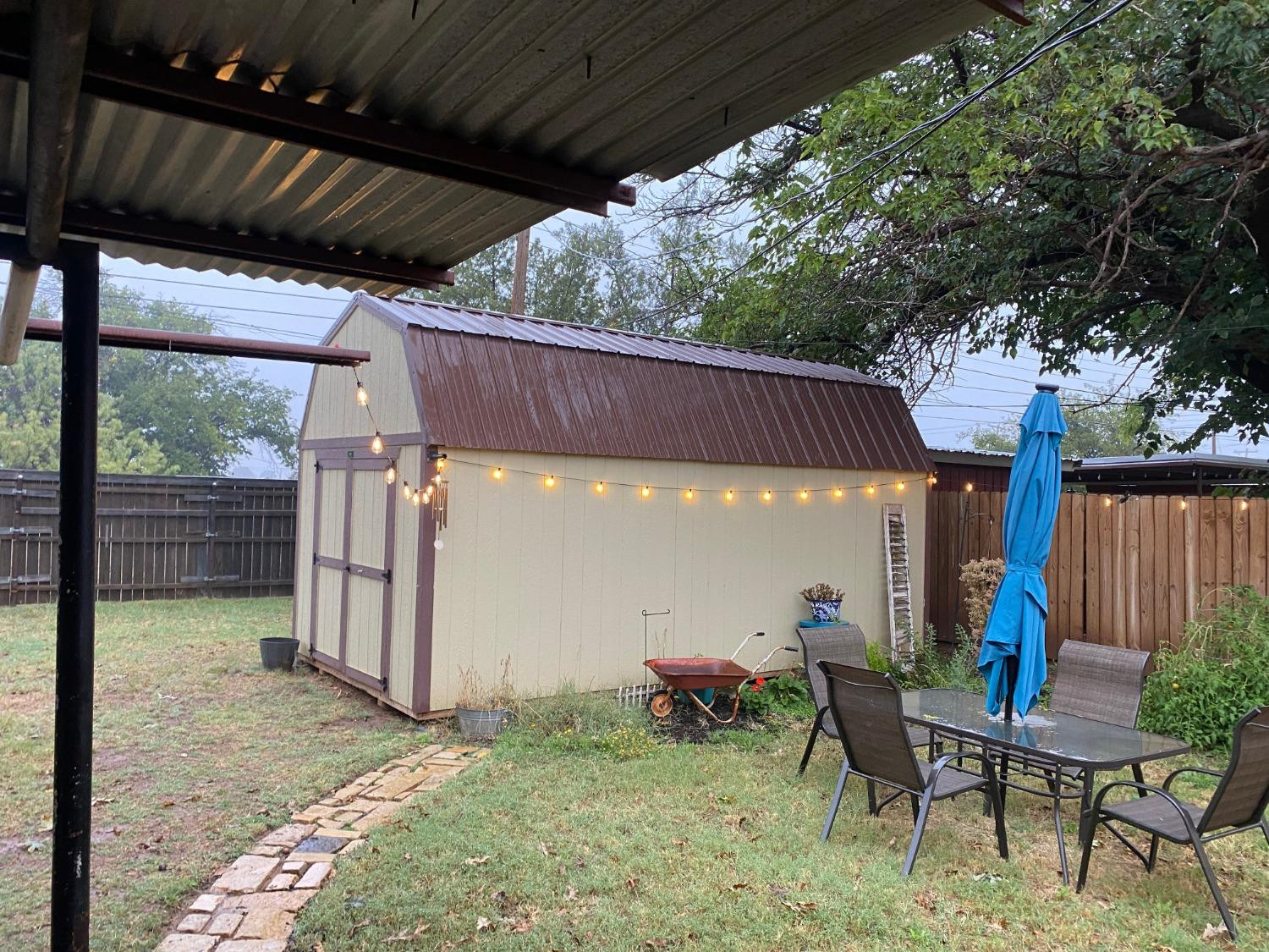 1006 West 11th Street Post, TX 79356 - Photo 34 of 39 a view of a backyard with furniture and a cabin