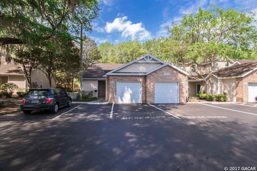 a view of a house with a yard and garage