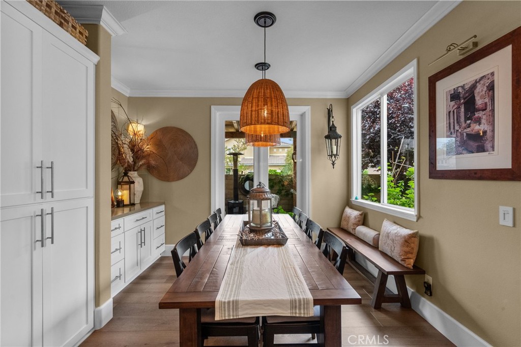 19969 Via Joyce Drive Saugus, CA 91350 - Photo 15 of 66 a dining room with wooden floor and a chandelier