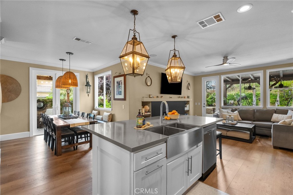 19969 Via Joyce Drive Saugus, CA 91350 - Photo 22 of 66 a kitchen with sink stove and living room view