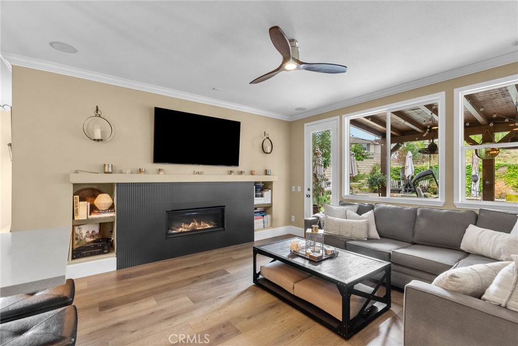 19969 Via Joyce Drive Saugus, CA 91350 - Photo 23 of 66 a living room with furniture a fireplace and a flat screen tv