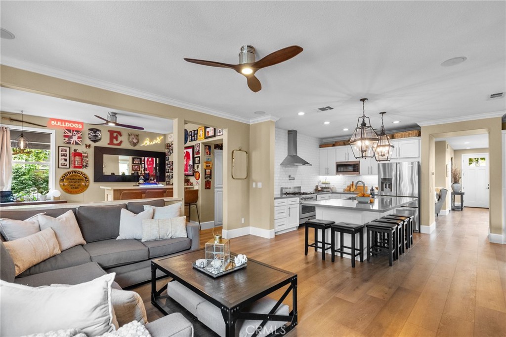 19969 Via Joyce Drive Saugus, CA 91350 - Photo 30 of 66 a living room with furniture kitchen view and a large window