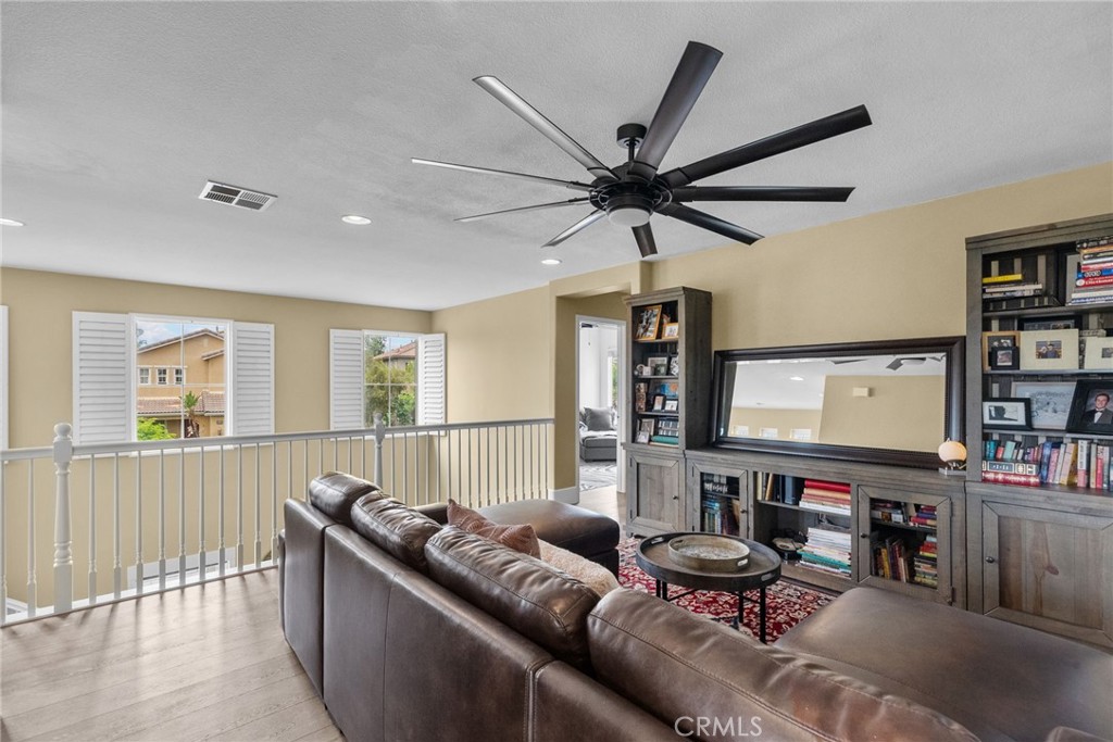 19969 Via Joyce Drive Saugus, CA 91350 - Photo 37 of 66 a living room with furniture and a flat screen tv