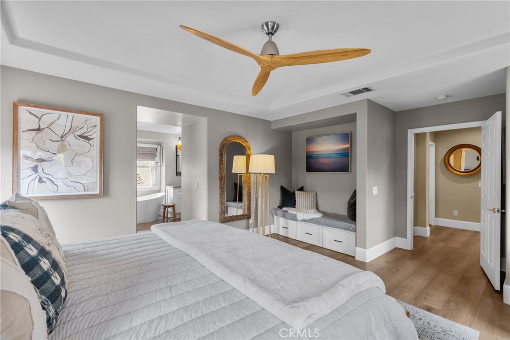 19969 Via Joyce Drive Saugus, CA 91350 - Photo 41 of 66 a bedroom with a bed and a large mirror on the dresser