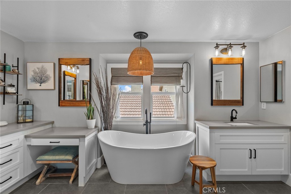 19969 Via Joyce Drive Saugus, CA 91350 - Photo 43 of 66 a bathroom with a sink and a mirror