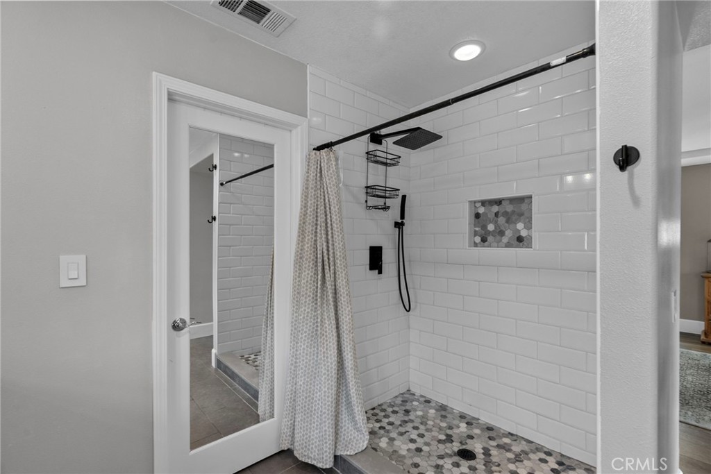 19969 Via Joyce Drive Saugus, CA 91350 - Photo 46 of 66 a bathroom with a shower and a sink