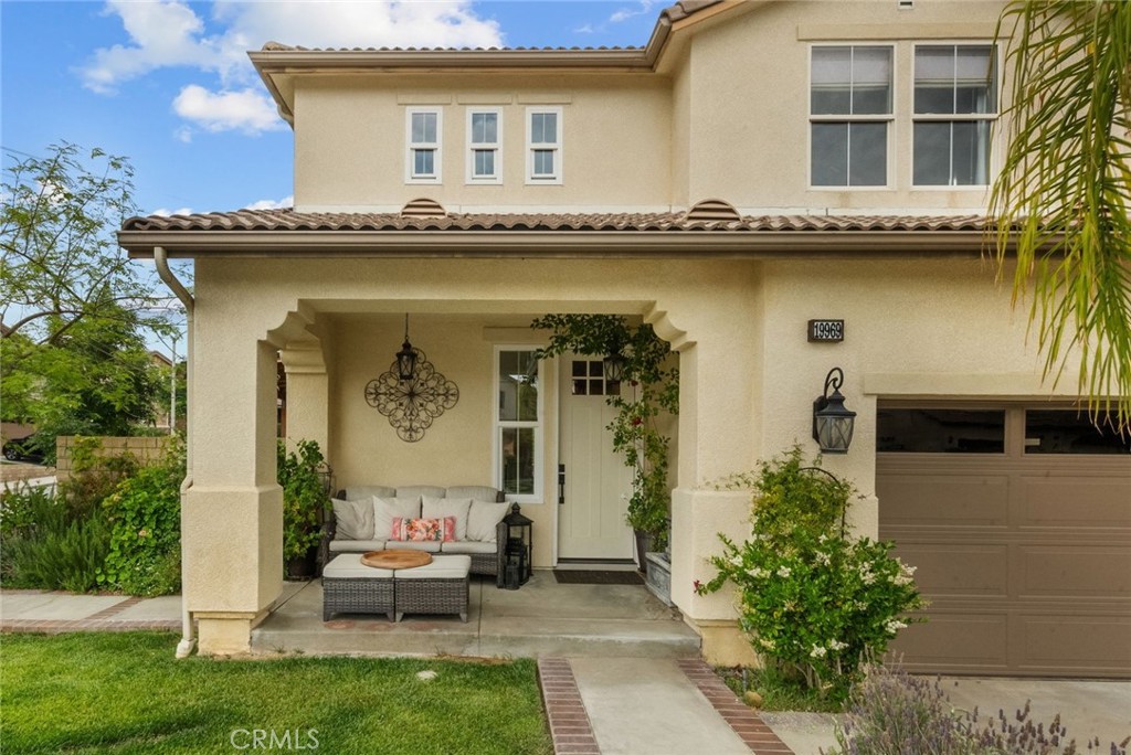 19969 Via Joyce Drive Saugus, CA 91350 - Photo 7 of 66 a front view of a house with garden