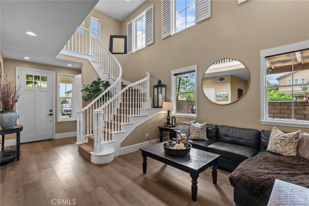 19969 Via Joyce Drive Saugus, CA 91350 - Photo 9 of 66 a living room with fireplace furniture and a wooden floor