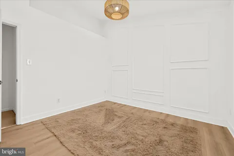 a bathroom with a granite countertop sink a mirror and a shower