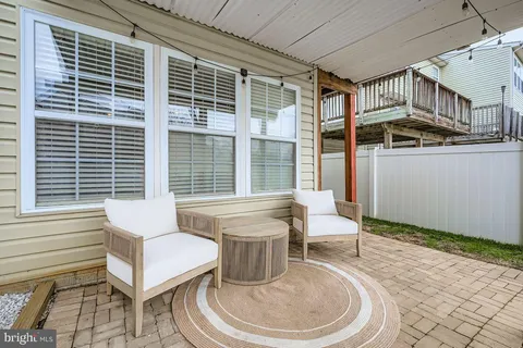 a living room with gym equipment and a table