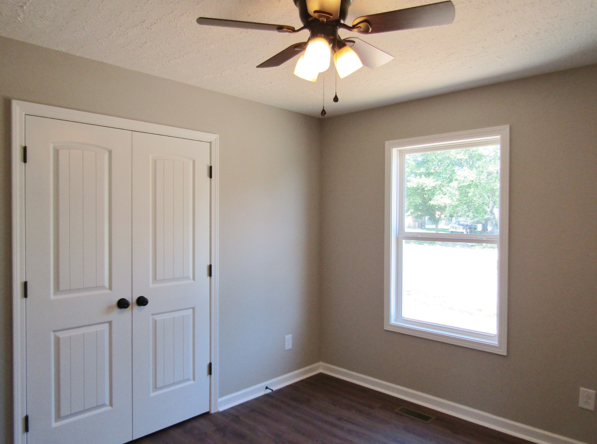 480 Crescent Factory Road Lawrenceburg, TN 38464 - Photo 12 of 14 an empty room with wooden floor closet and windows