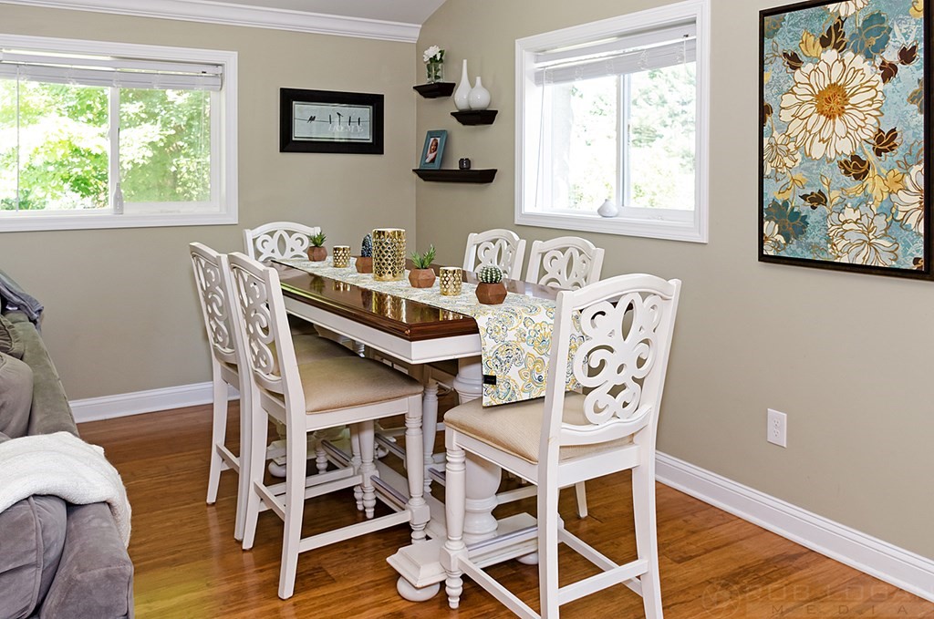 25 Cherry Road Framingham, MA 01701 - Photo 12 of 14 a view of a dining room with furniture and wooden floor