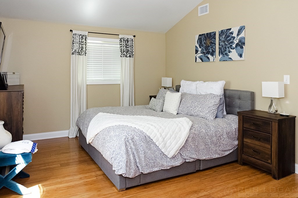25 Cherry Road Framingham, MA 01701 - Photo 8 of 14 a bedroom with a bed and wooden floor