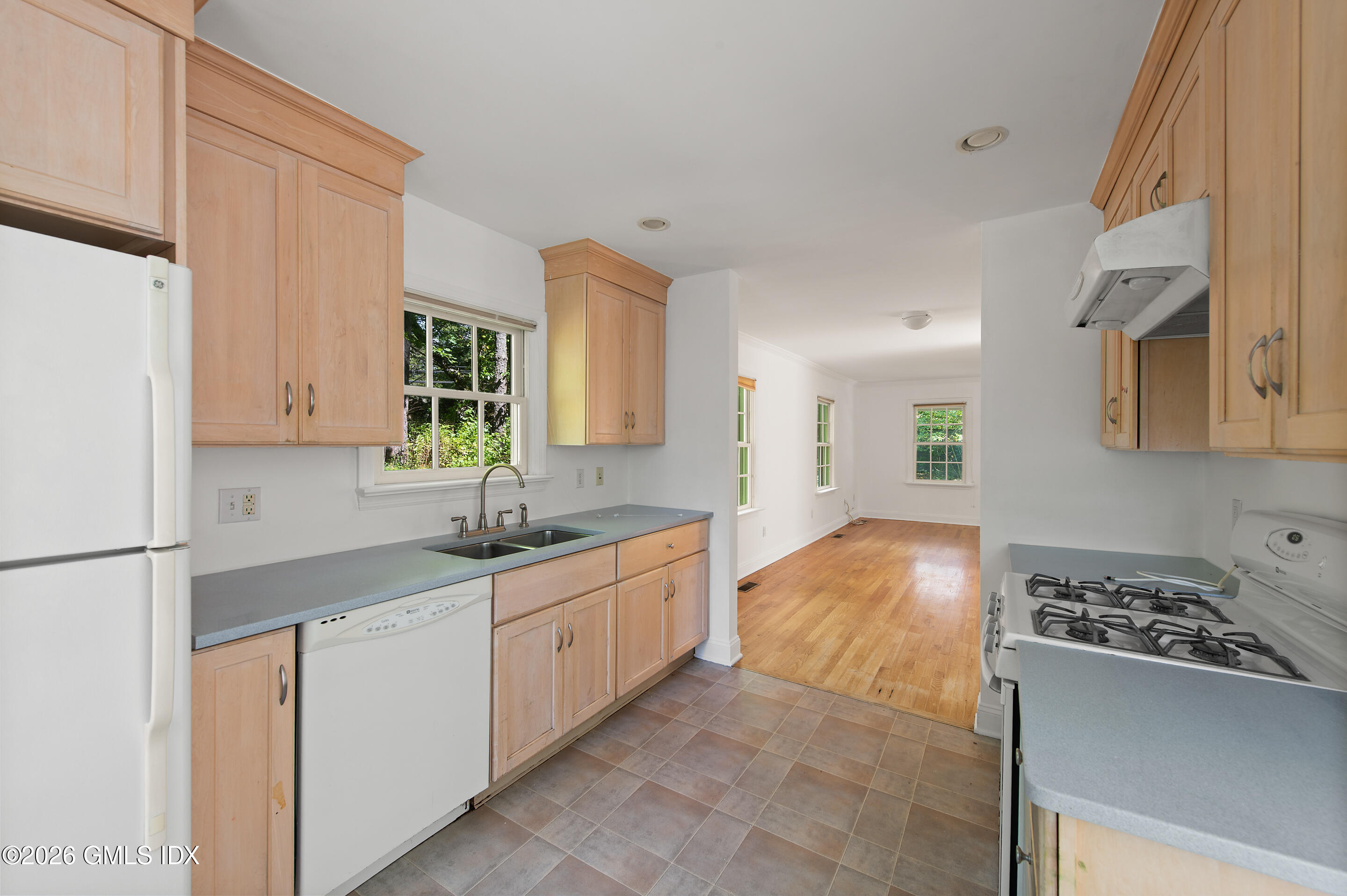 122 Round Hill Road Greenwich, CT 06831 - Photo 31 of 37 a kitchen with granite countertop a sink and cabinets