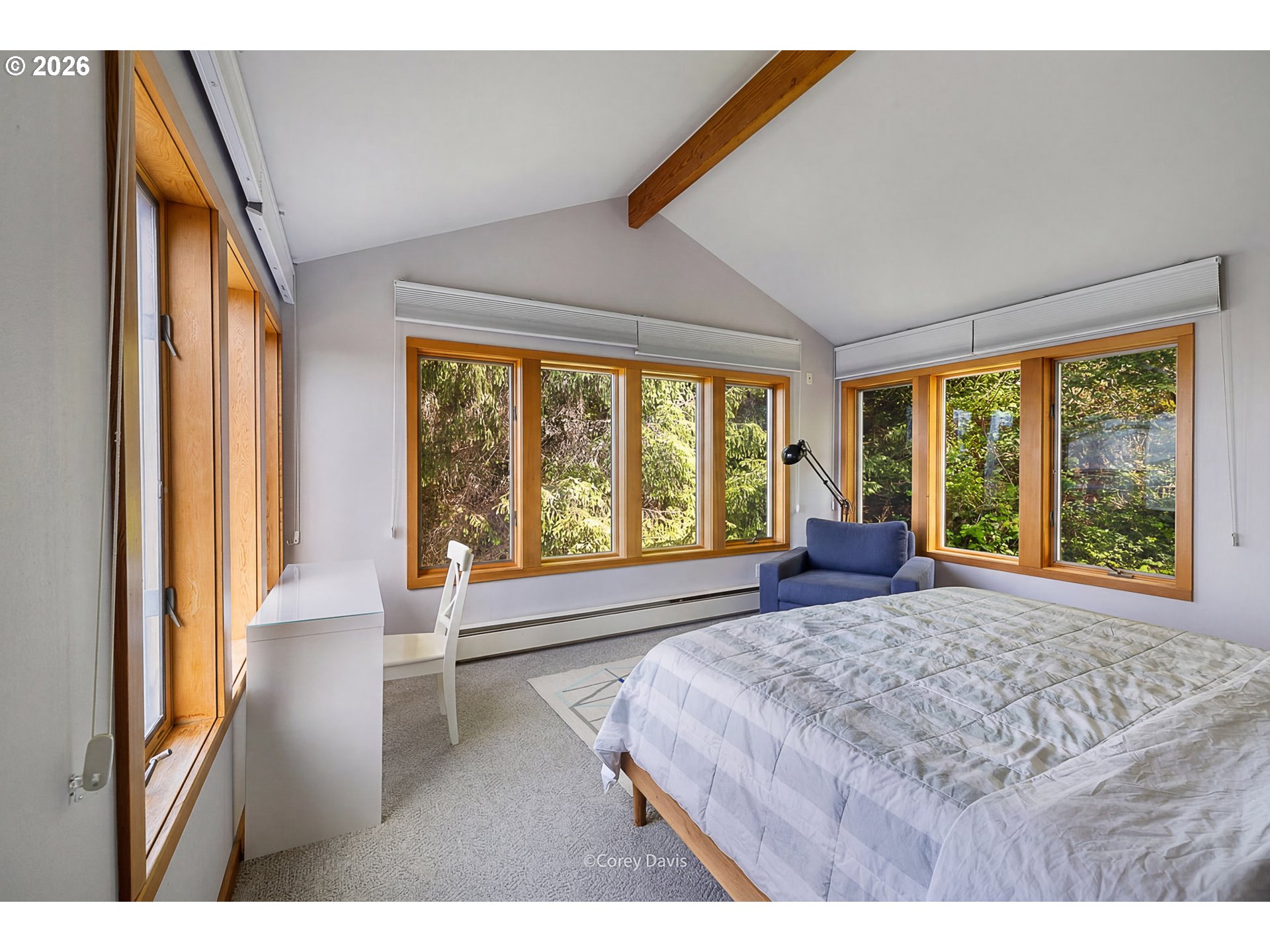 38295 Beulah Reed Road Nehalem, OR 97131 - Photo 31 of 42 a large bedroom with a large bed and a large window